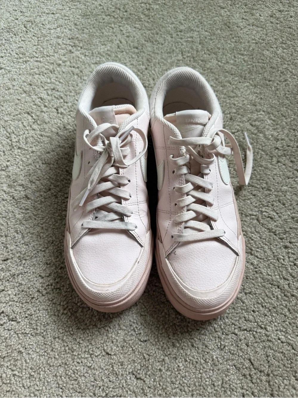 Nike Women’s Light Pink Low-Top Sneakers with White Swoosh